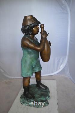 Boy holding a bottle water fountain Size 17L x 14W x 38H