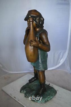 Boy holding a bottle water fountain Size 17L x 14W x 38H