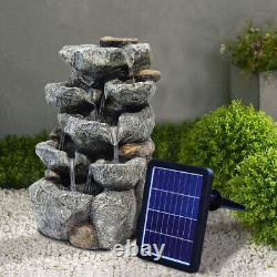 Caractéristiques de jardin extérieur : Fontaine LED avec cascade de roches, paysage alimenté par énergie solaire.