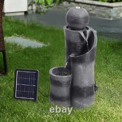 Fontaine à eau en forme de boule noire avec éclairage, alimentée par énergie solaire, pour patio de jardin extérieur.