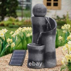 Fontaine à eau en forme de boule noire avec éclairage, alimentée par énergie solaire, pour patio de jardin extérieur.