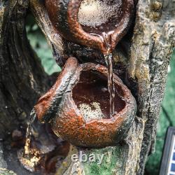 Fontaine cascade à plusieurs niveaux avec éclairage LED pour jardin solaire, décor extérieur rocheux.