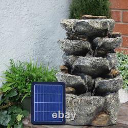 Fontaine d'eau de jardin extérieure en cascade de pierre rocheuse alimentée par l'énergie solaire