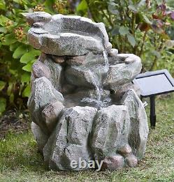 Fontaine de jardin en cascade de rochers alimentée par l'énergie solaire